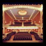 An ornate red and gold theater interior